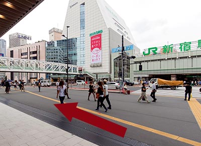 Please go to 2nd floor (Shinjuku Station, pedestrian area) using escalator or stairs. From Koshu-Kaido Exit, walk towards West Shinjuku.