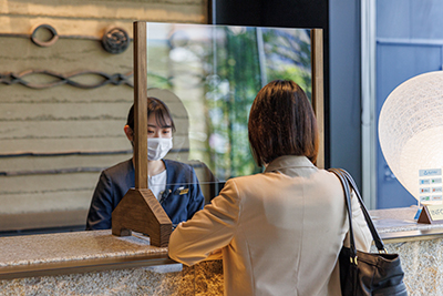Placing a clear panel between guests and staff